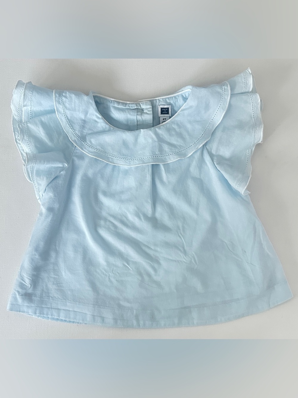 Janie and Jack girl’s sleeveless top large, ruffled Peter Pan collar.  Size 2T.